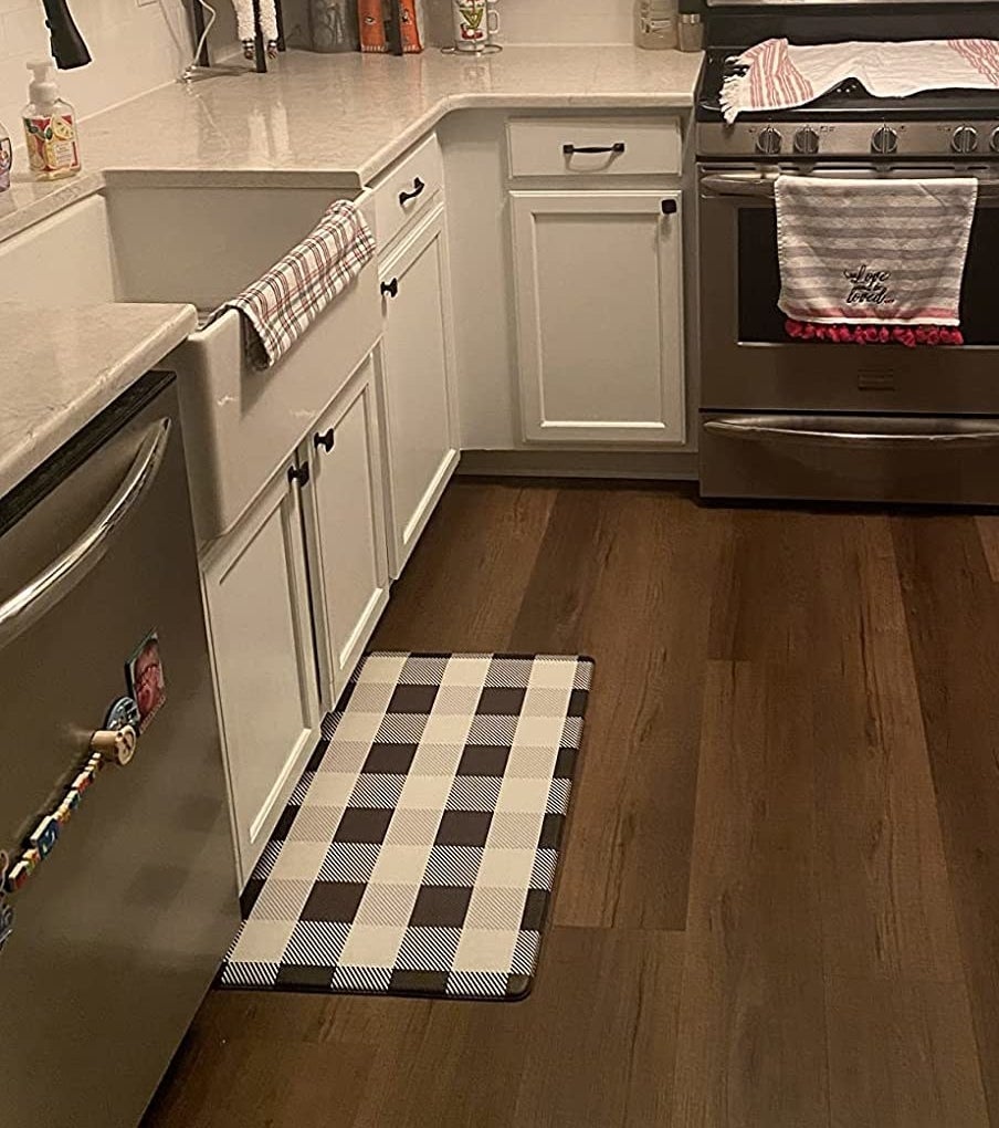 Reviewer image of buffalo check mat in front of kitchen sink