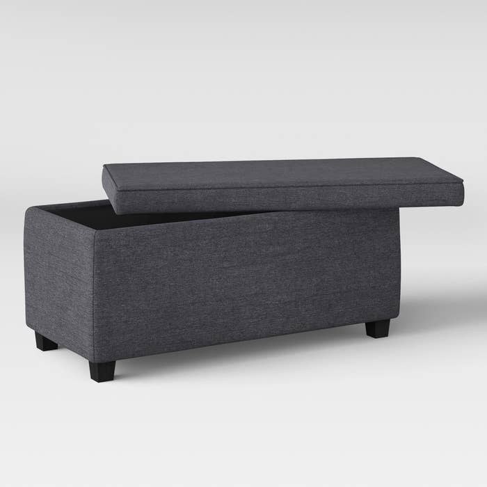 the gray bench shown with the lid partially off
