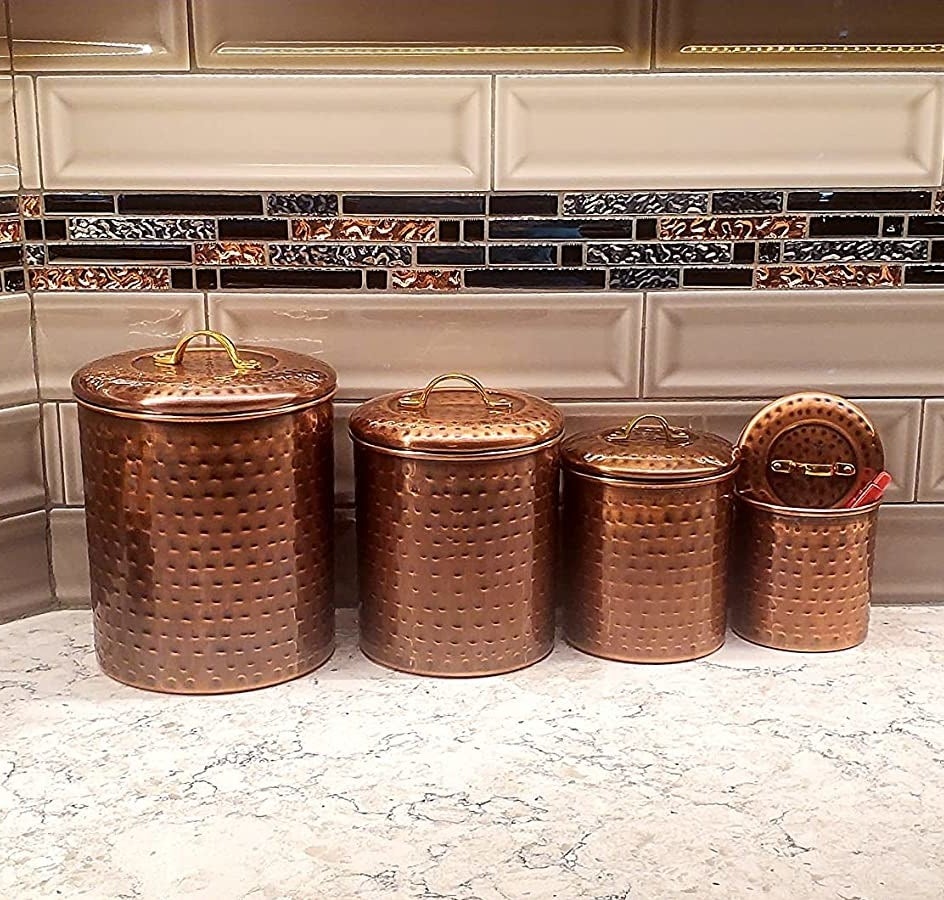 Reviewer image of copper canisters on kitchen countertop
