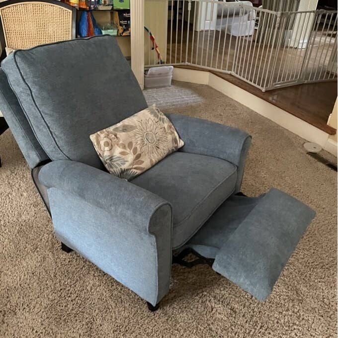 a reviewer photo of the gray recliner