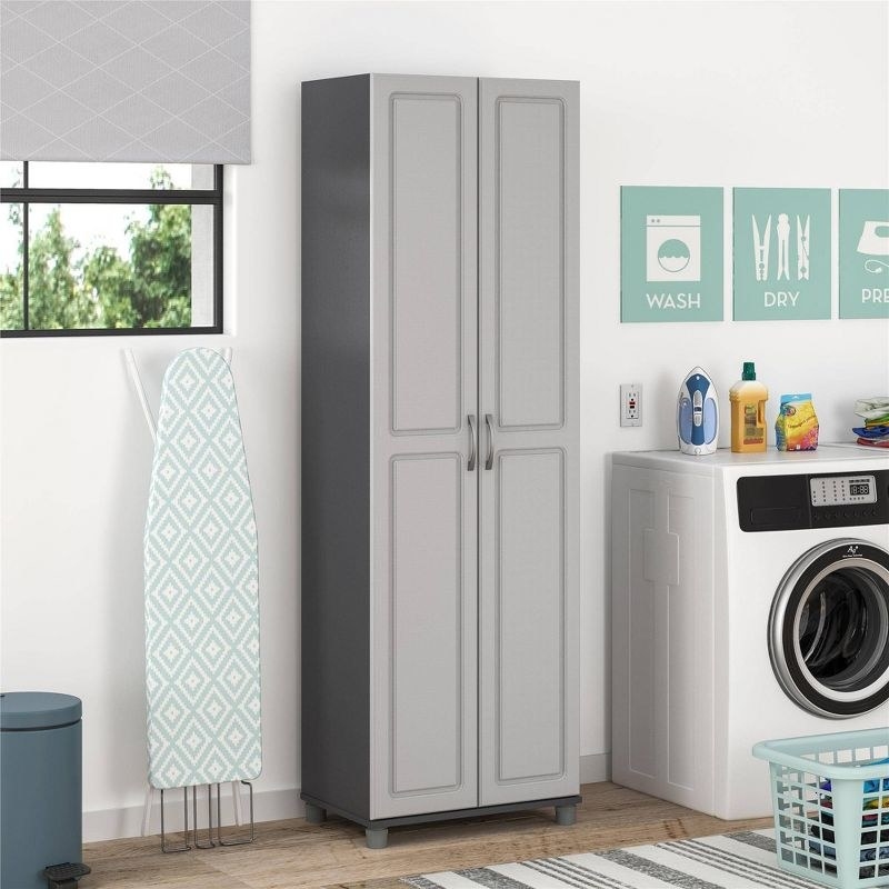 a gray utility storage cabinet in a laundry room