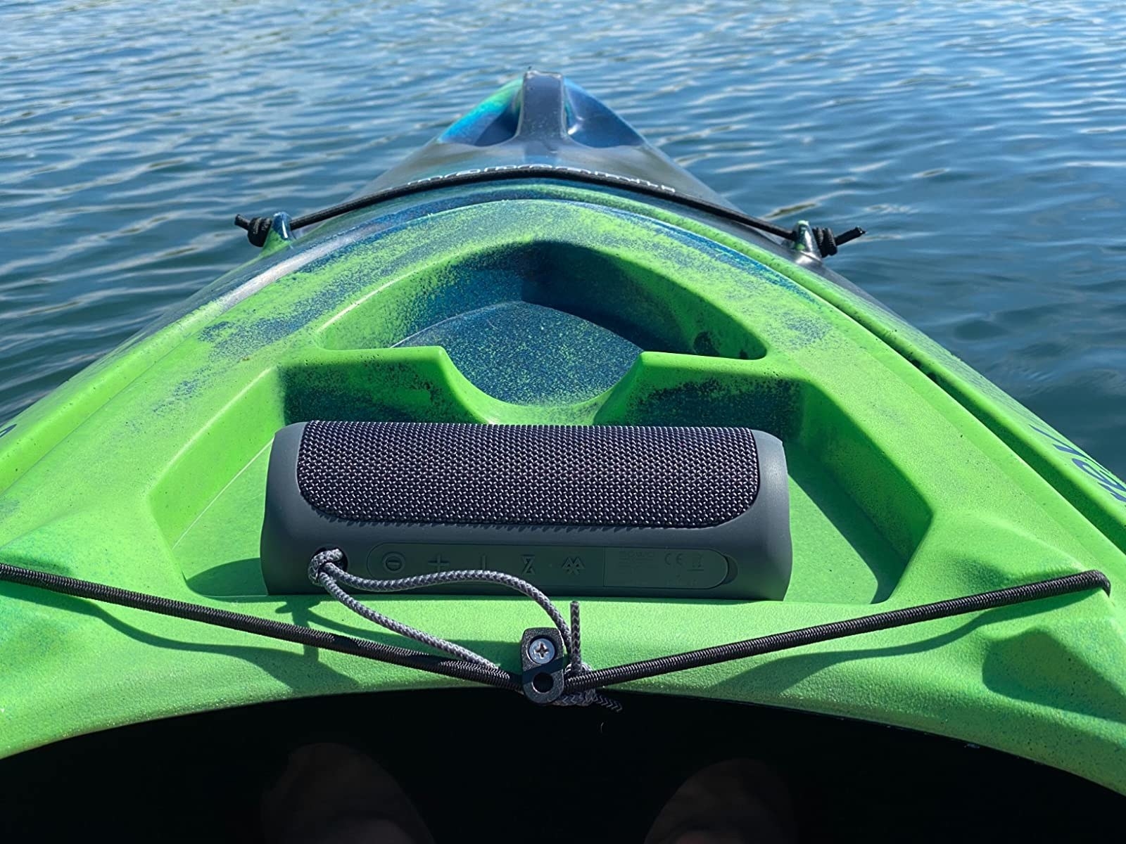 Reviewer image of black speaker on a green kayak