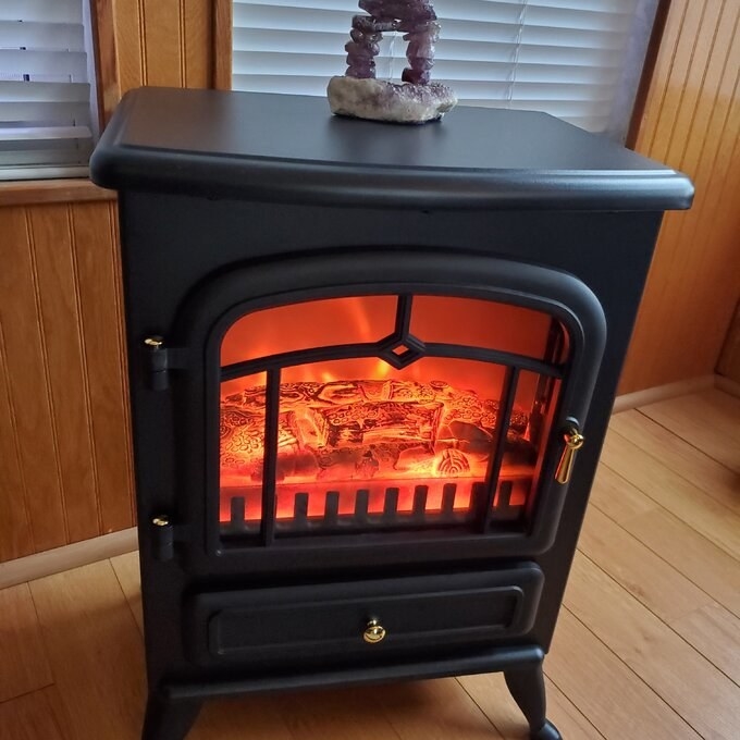 a reviewer photo of the black fireplace