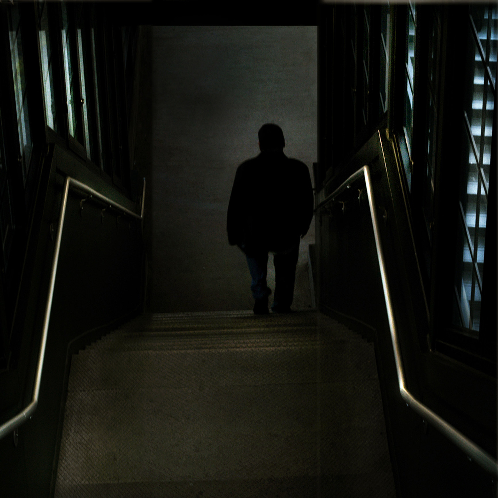 shadow figure at bottom of staircase