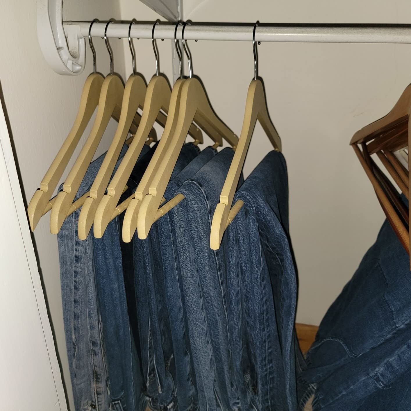 Jeans hanging on hangers