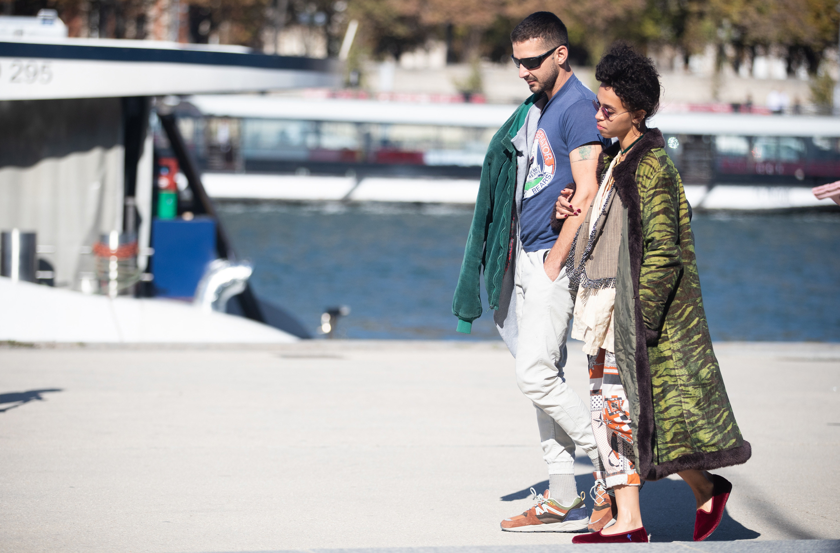 Shia and FKA Twigs walking arm and arm