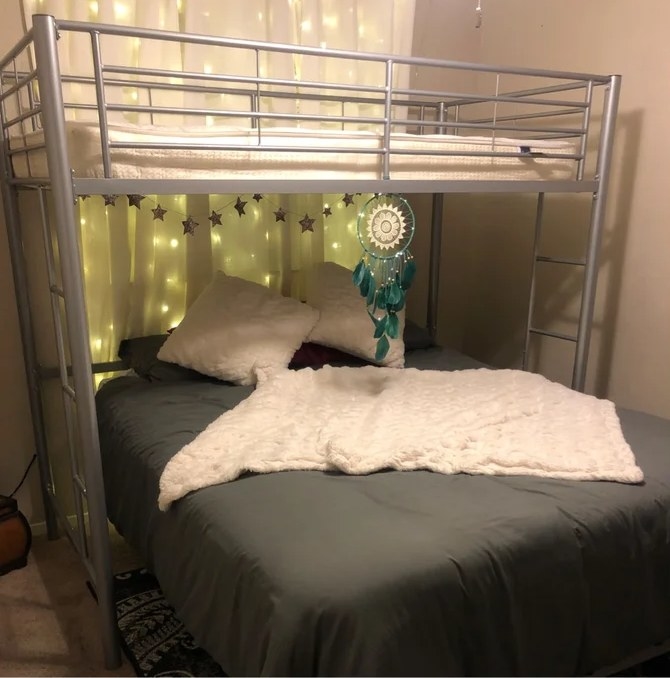 A reviewer&#x27;s image of the silver platform loft bed frame