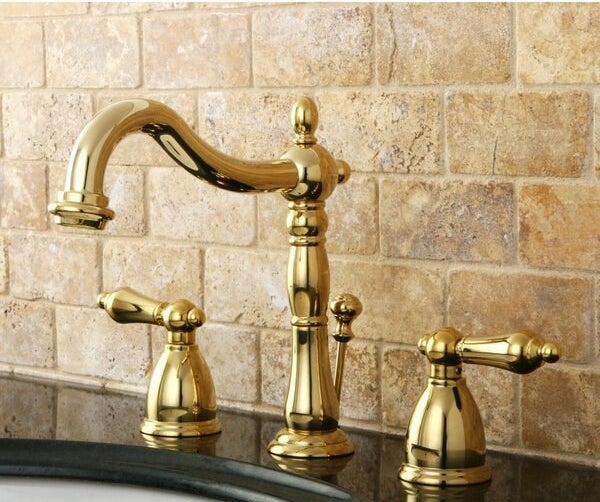 ornate polished brass faucet and handles