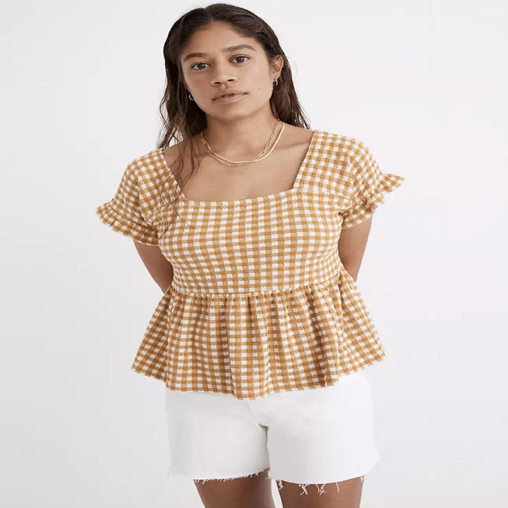 model wearing gingham ruffle top