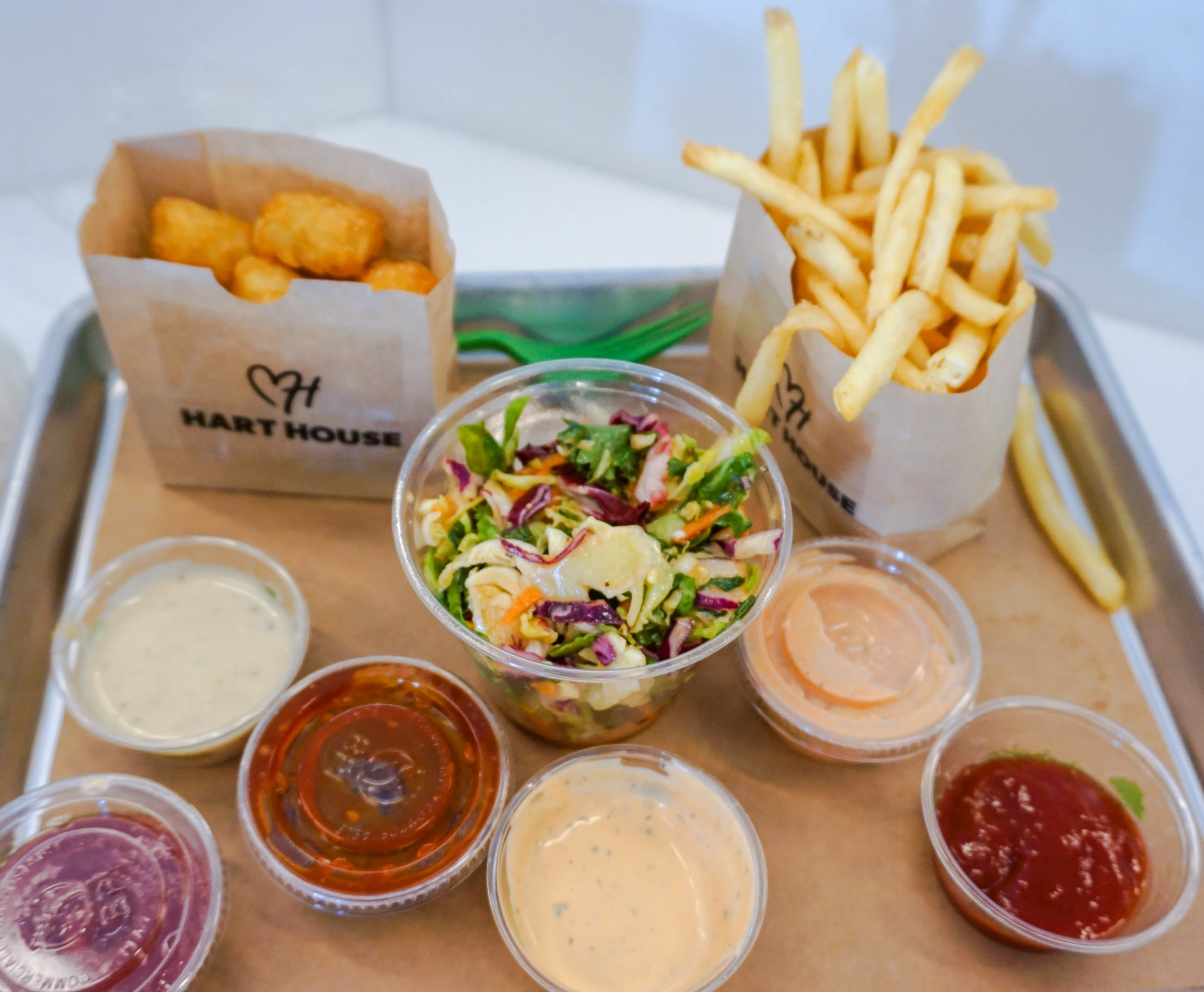fries, tots, salad, and dipping sauces