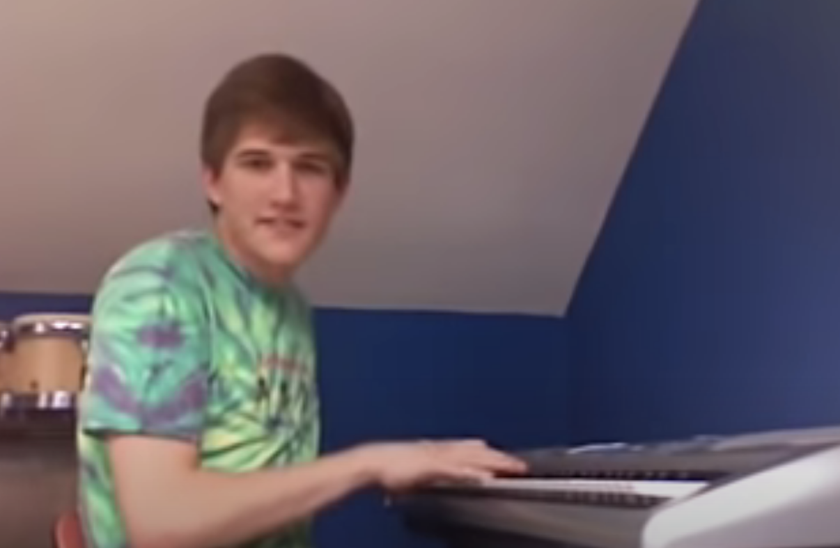 Bo Burnham playing a keyboard