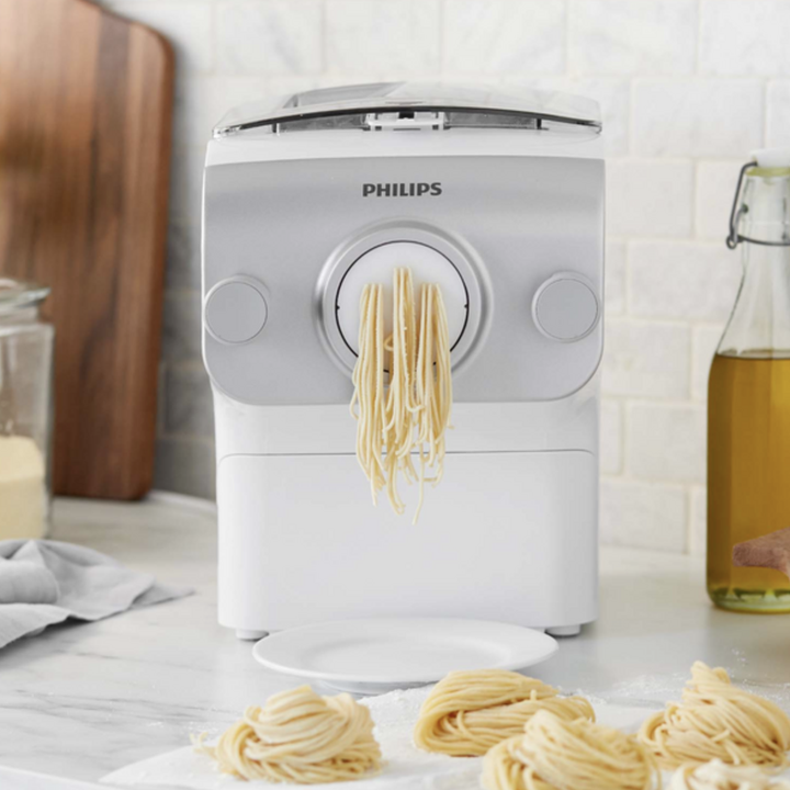 Philips pasta maker with spaghetti on kitchen counter