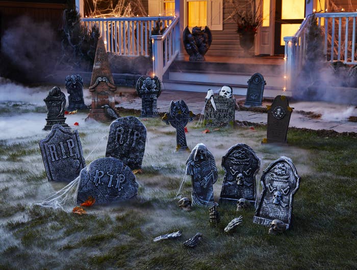 fake gravestones in front of house