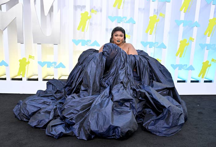Lizzo in a voluminous off the shoulder gown