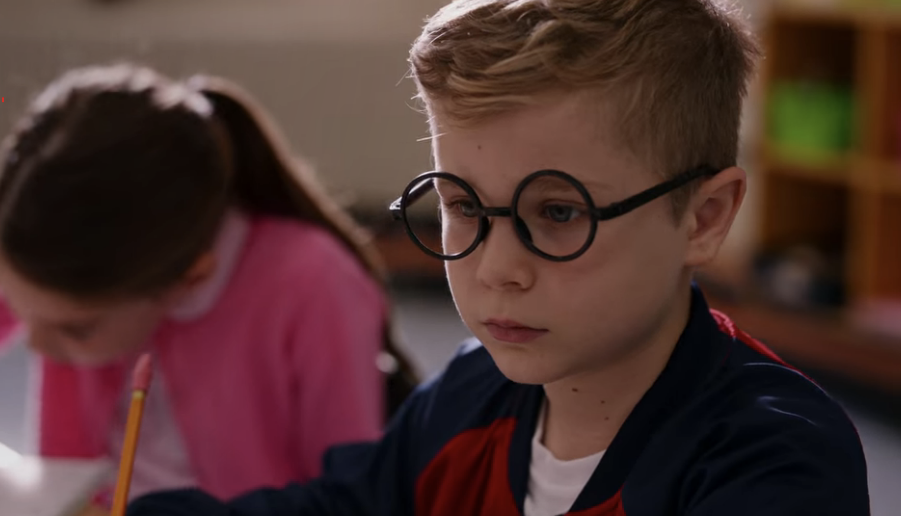 A little boy with glasses