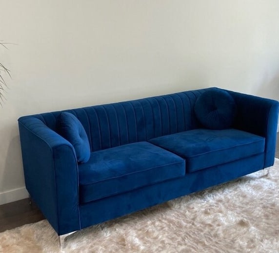 a reviewer photo of the blue couch