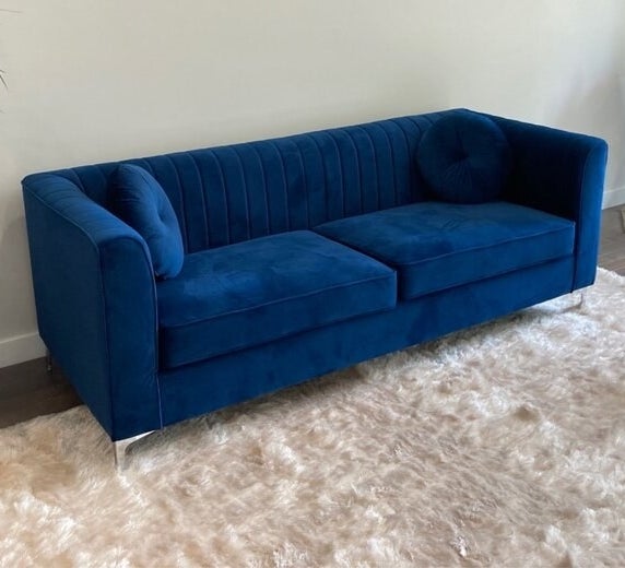a reviewer photo of the blue couch