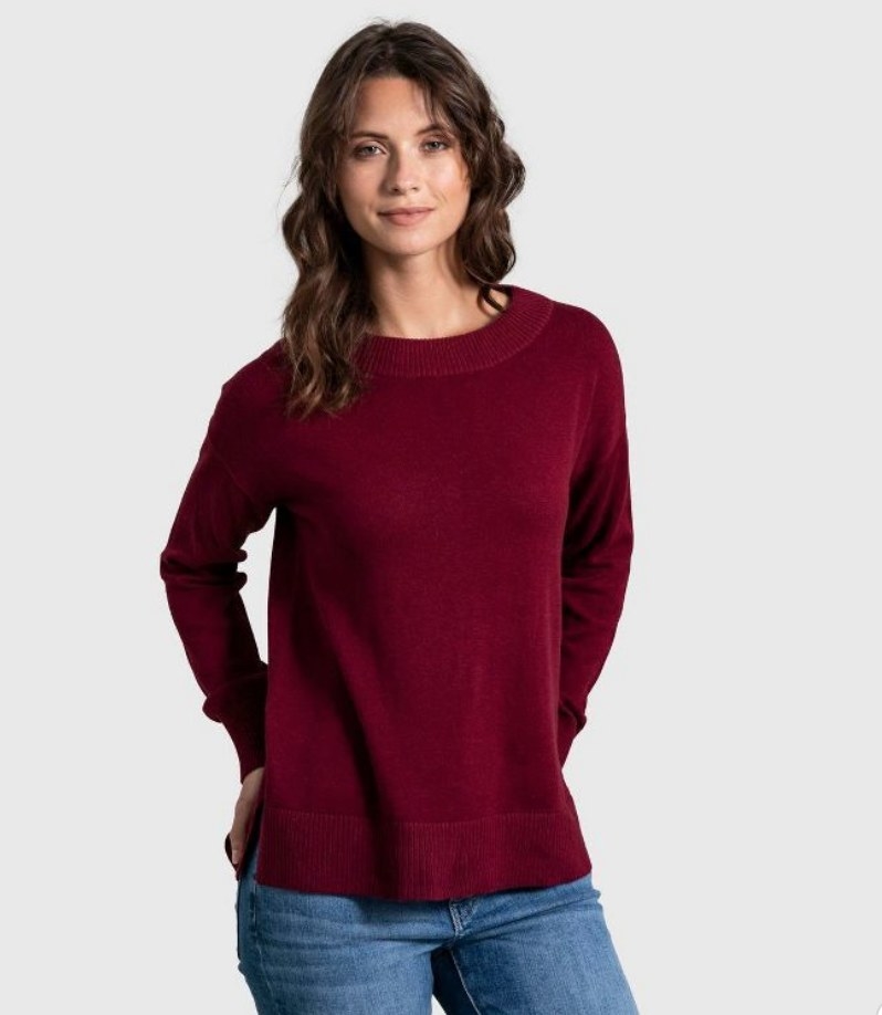 A model wearing a maroon crew neck sweater
