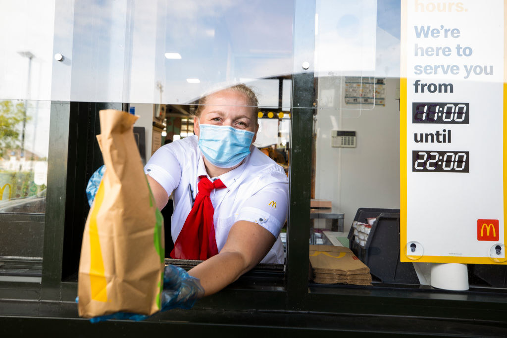 A worker at the drive-thru