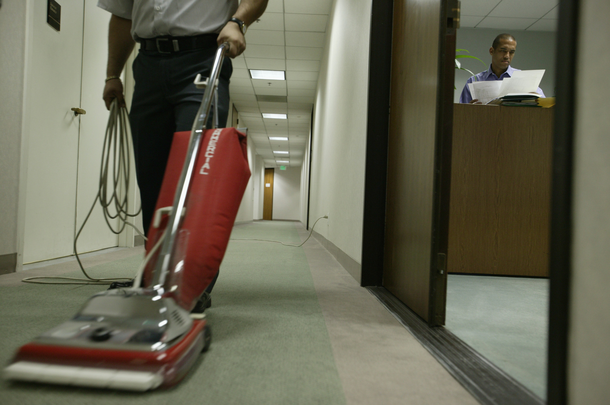 janitor vacuuming