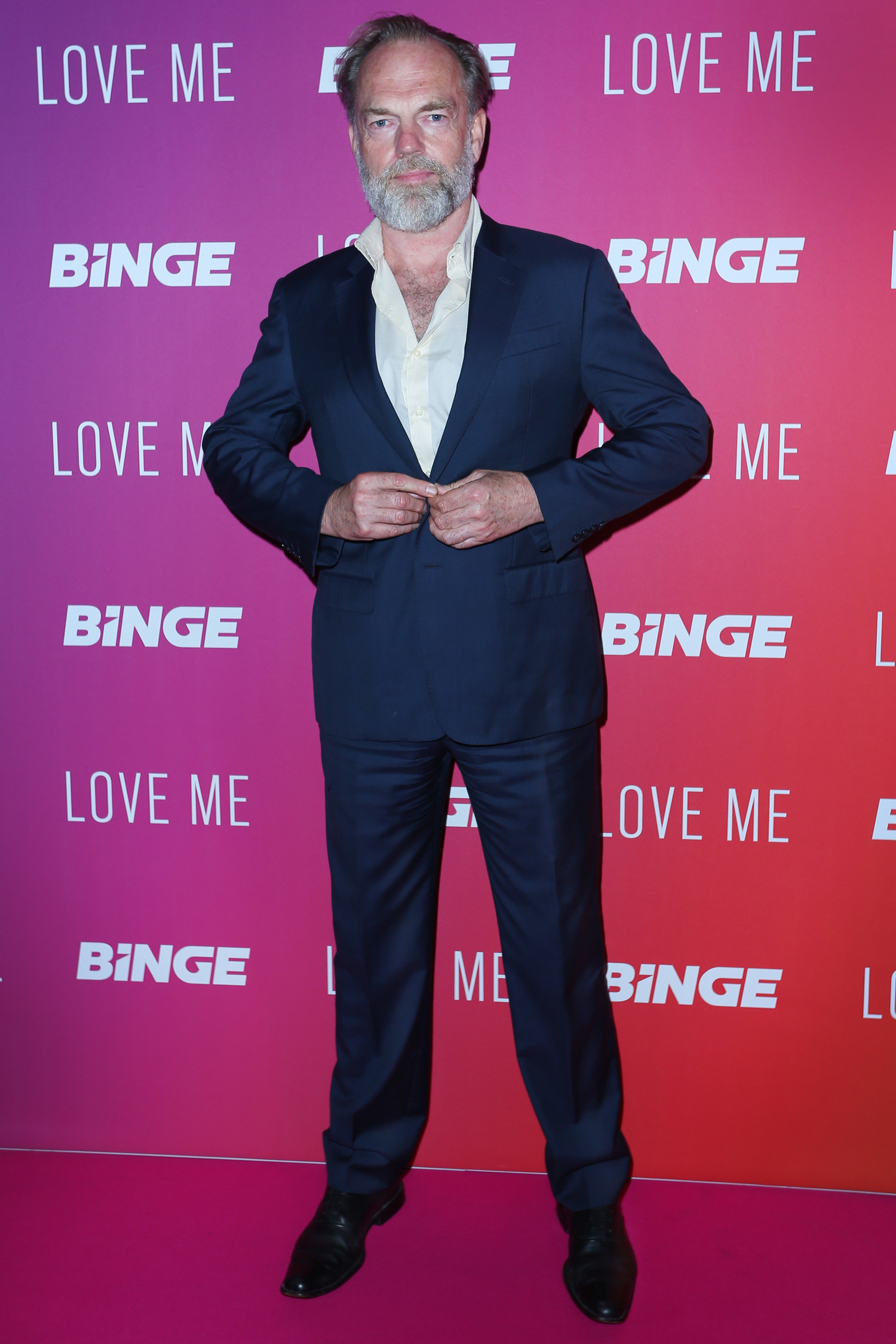 Hugo Weaving posing on a red carpet