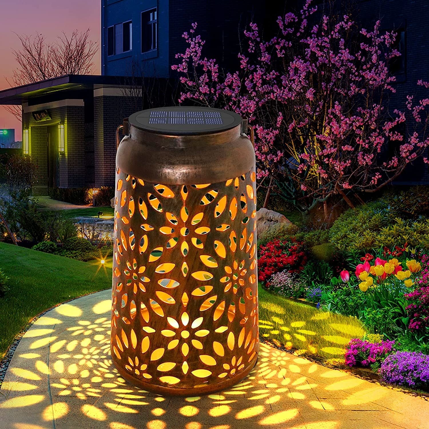 the lantern lit up at night with the pattern on the ground