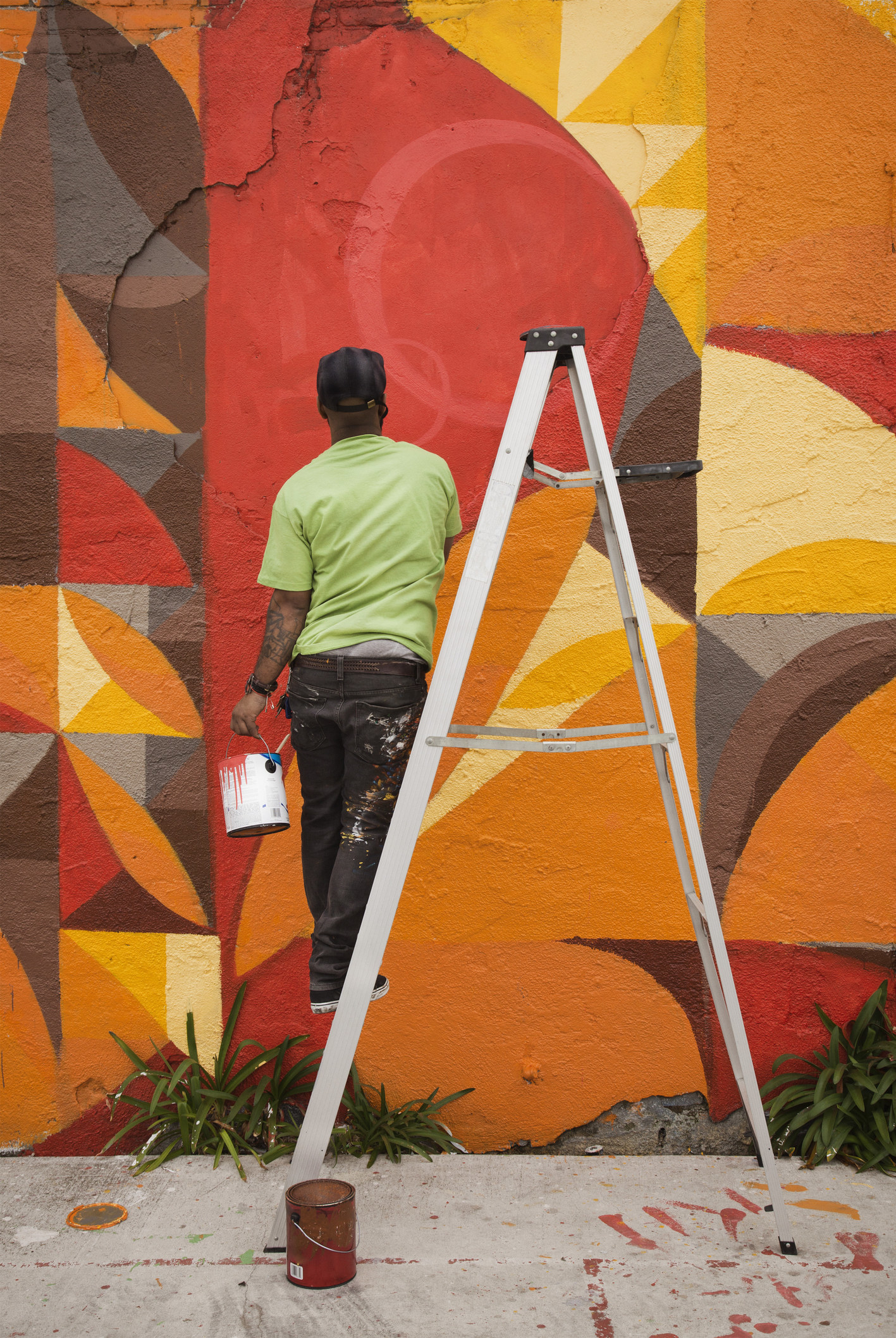a man painting a mural