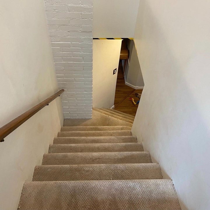 a reviewer after photo of the same stairwell with no mess or stains