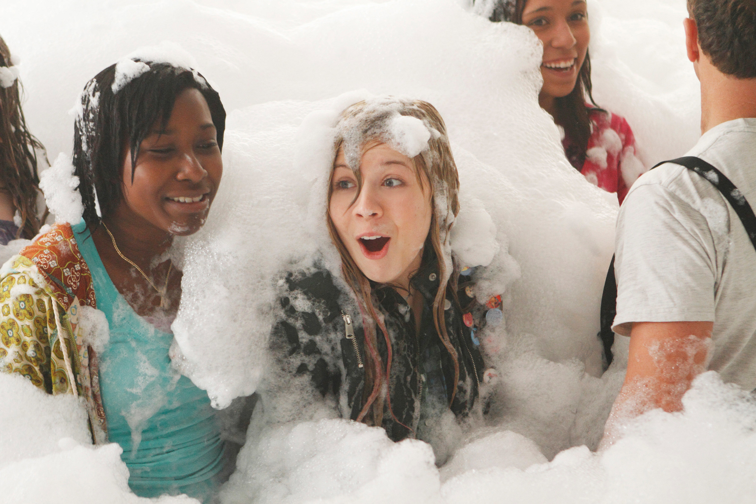 Jennette with other young people covered in foam