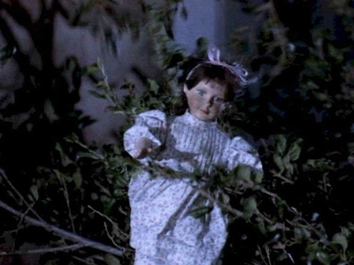 Miss Honey&#x27;s doll amid tree branches