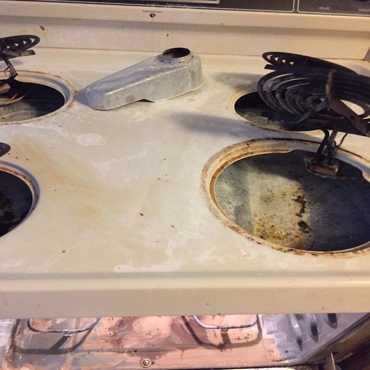 a reviewer before photo of a very dirty stovetop