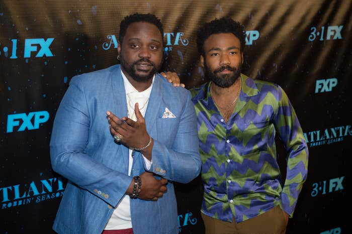Brian Tyree Henry and Donald Glover pose for photographers on the red carpet at an event