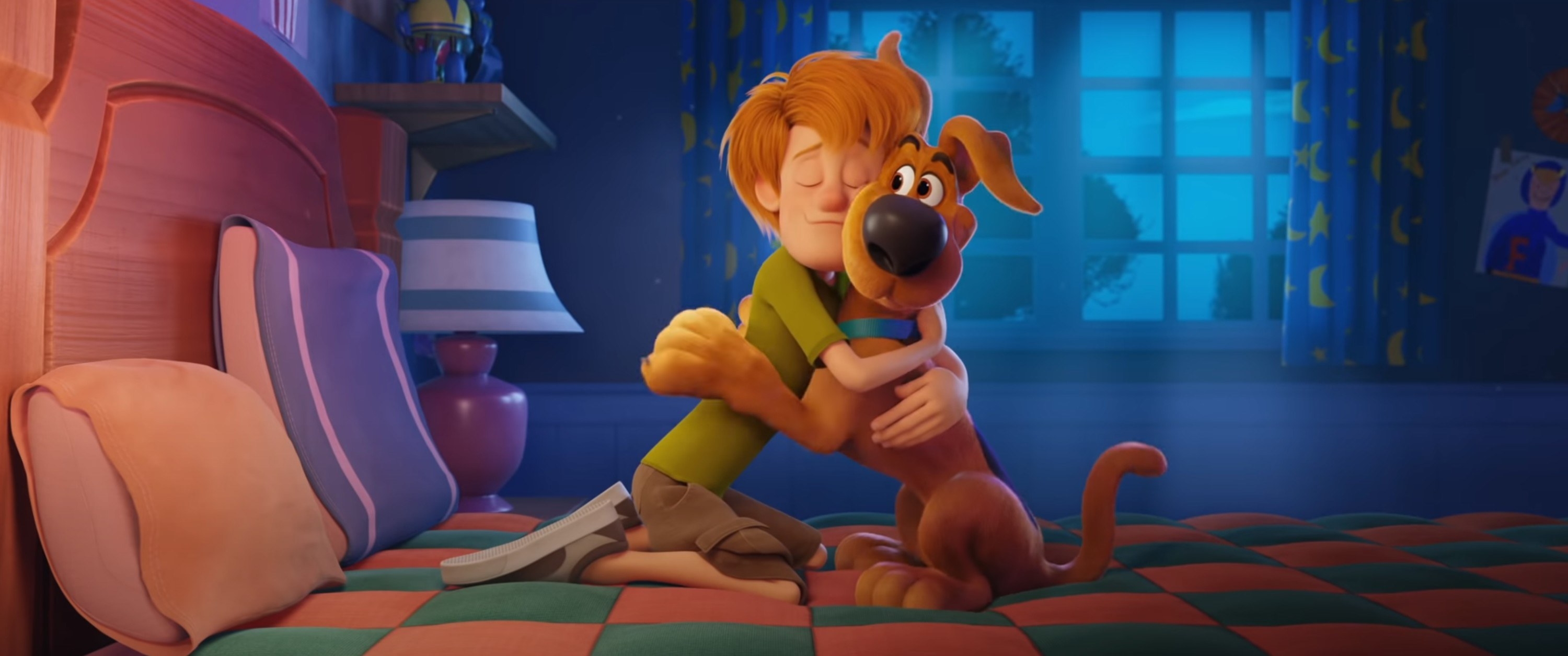 A young Scooby and Shaggy hugging on a bed