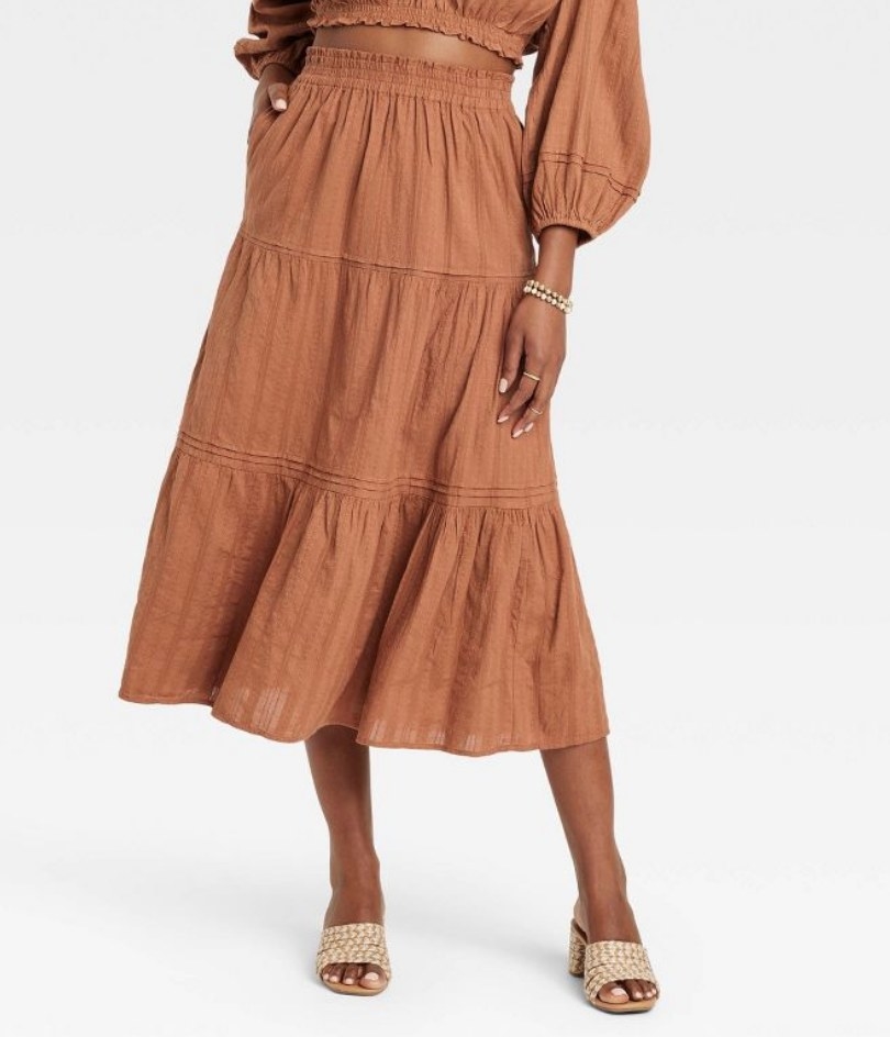 A rust a-line tiered skirt