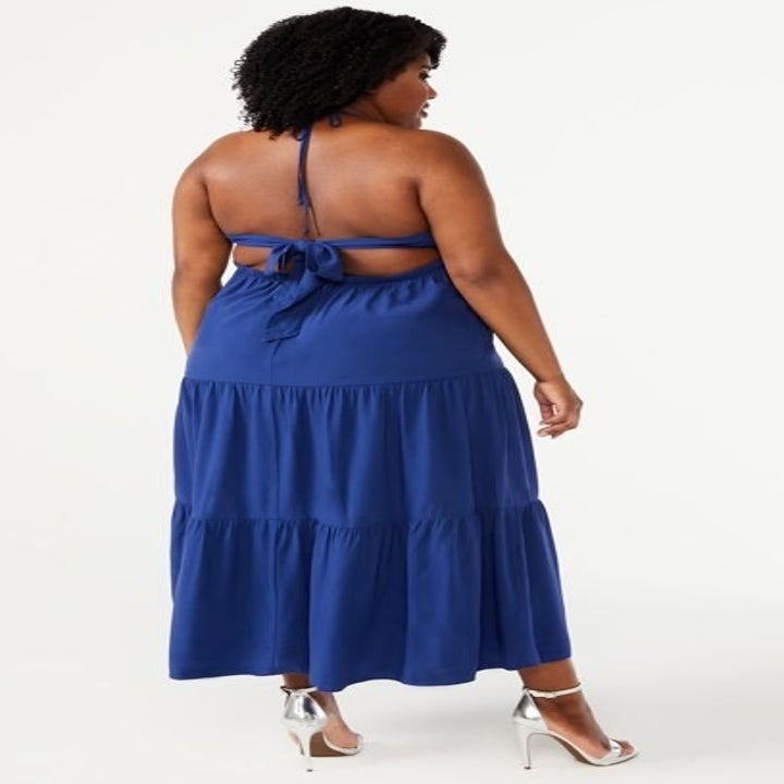 Model showing back of blue dress