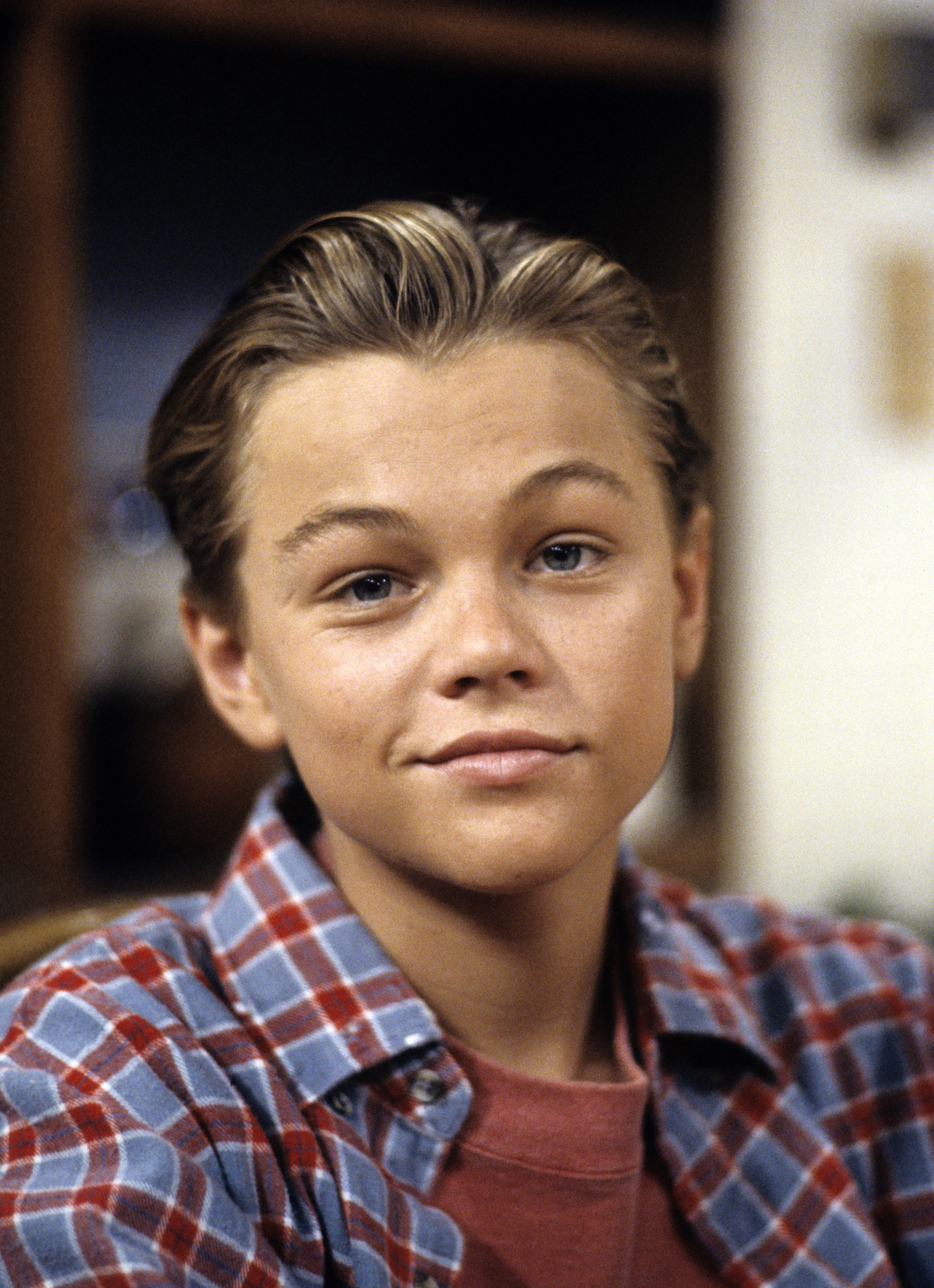 A teenage Leonardo DiCaprio posing on for the camera