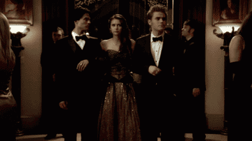 Damon, Elena, and Stefan at a formal party