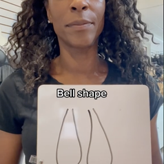 Screenshot from a video by TikTok userr @nicolacrookonline holding a drawing of bell shaped breasts