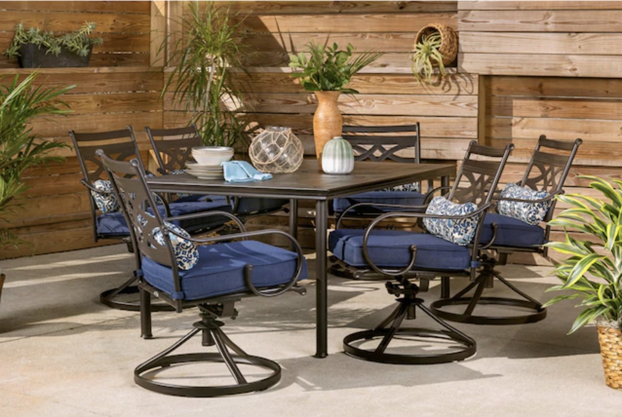 The patio set with blue seat cushions