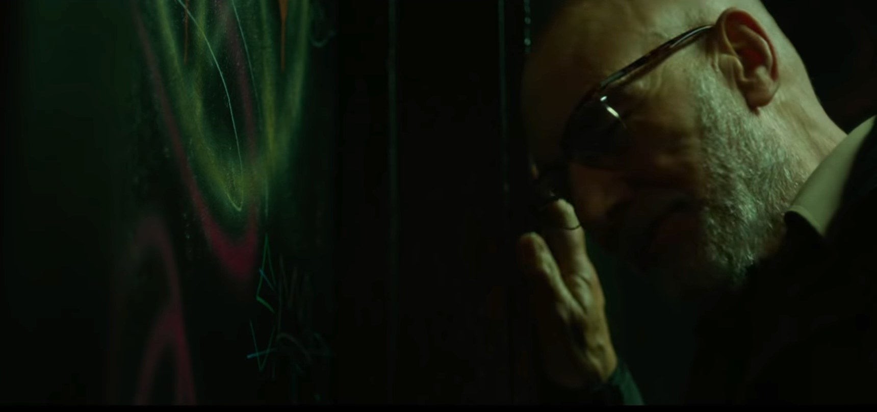 Close-up of Darcy next to a door in &quot;Green Room&quot;