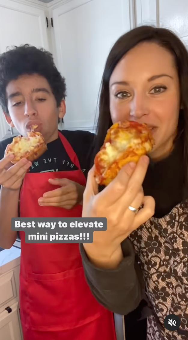 Two people eating garlic pizza bread with caption &quot;Best way to elevate mini pizzas!!&quot;