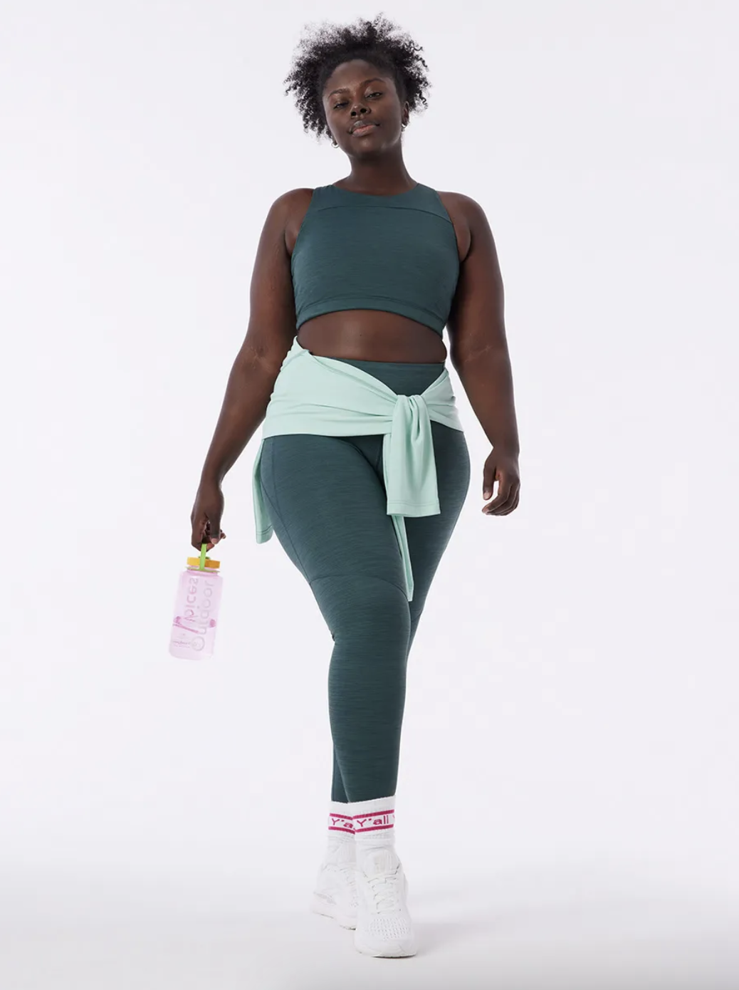 model wearing a green workout set
