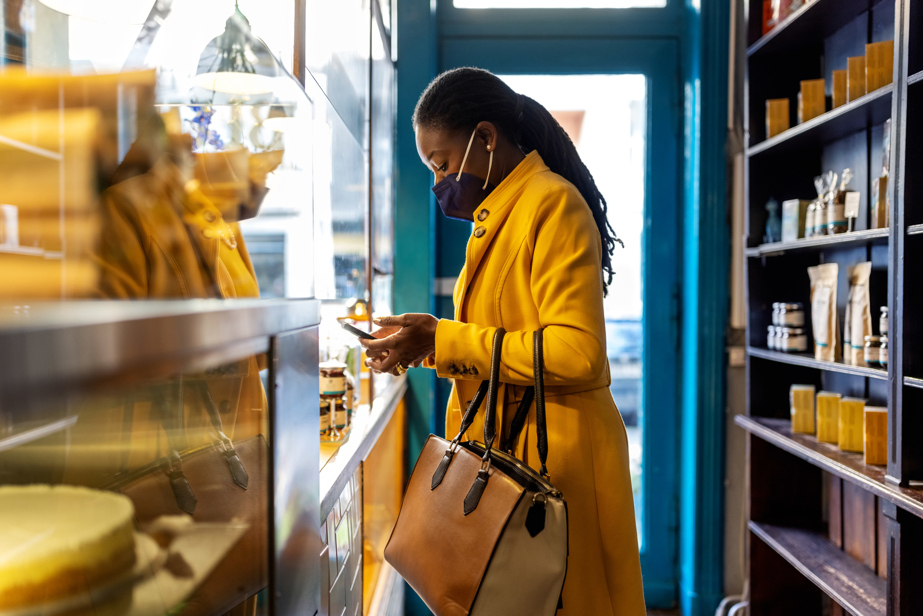 a woman with a mask inside a store