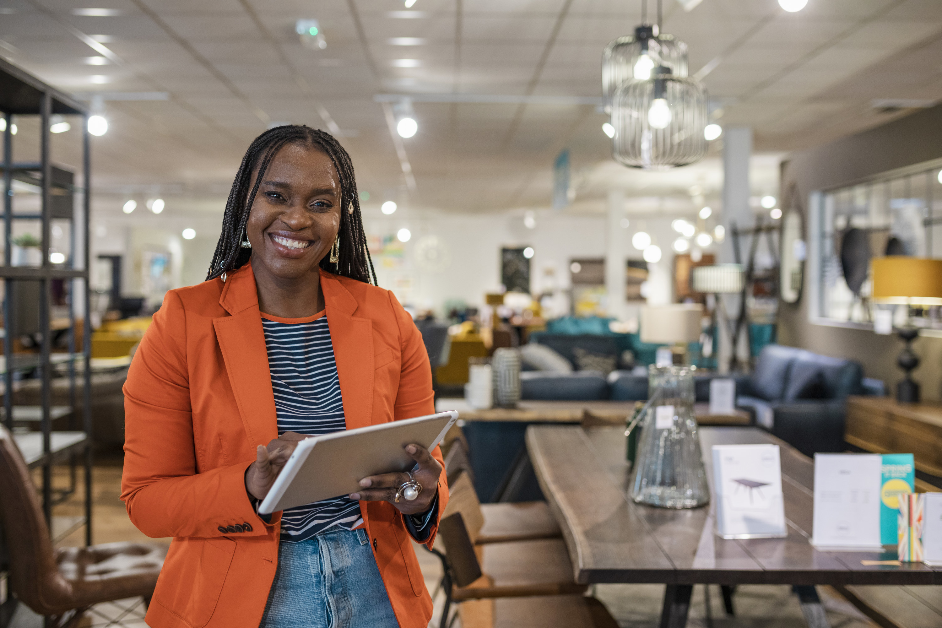 a store manager inside a store with a clipboard