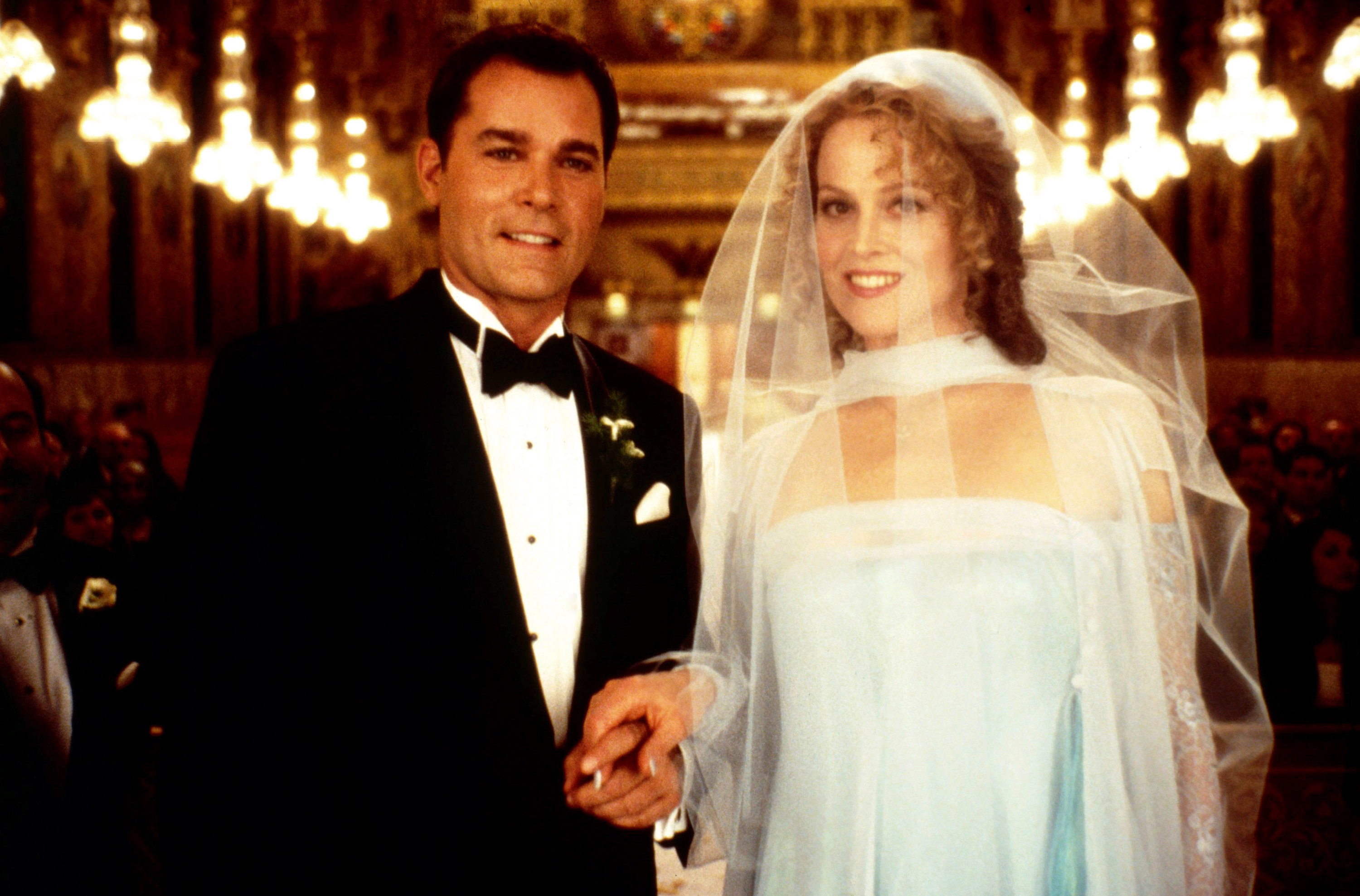Ray and Sigourney as groom and bride in a movie