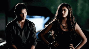 Katherine and Damon looking perplexed