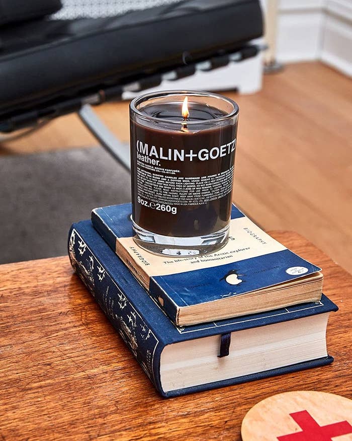the candle on a stack of books