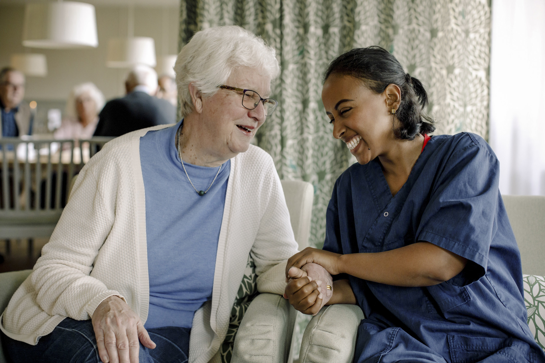 A healthcare worker with an older person