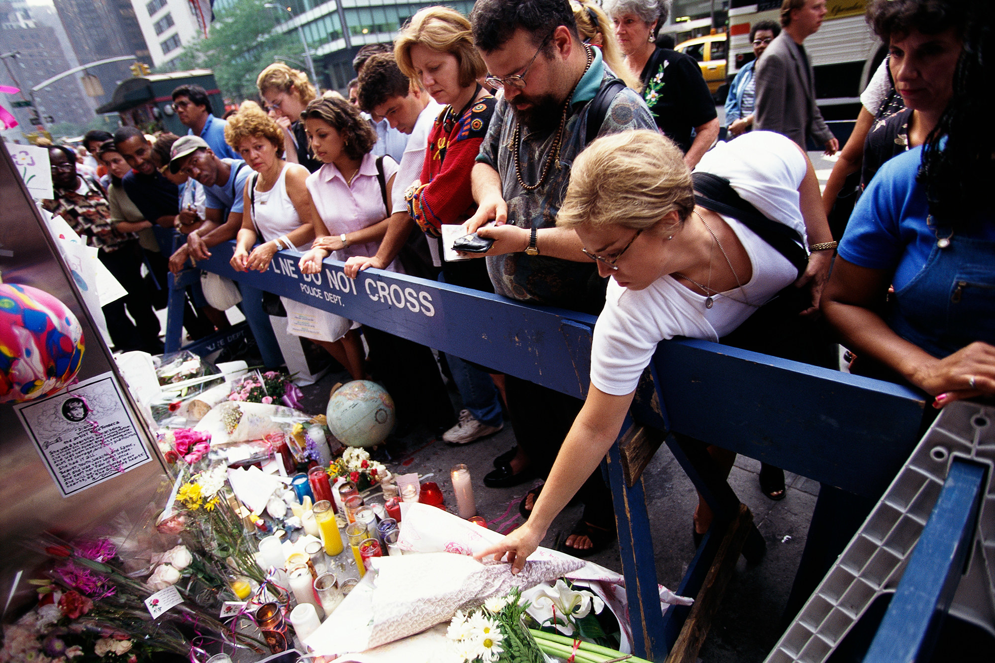 People gather and lay tributes to Princess Diana at the British Embassy in ...