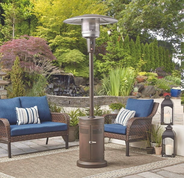 Outdoor heater in front of patio furniture on patio